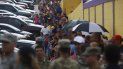 Personas damnificadas por el paso del huracán María hacen fila para recibir del ejército sus raciones de suministros en Las Piedras (Puerto Rico). Personas damnificadas por el paso del huracán María hacen fila para recibir del ejército sus raciones de suministros en Las Piedras (Puerto Rico).