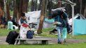Un grupo de venezolanos se prepara para ser trasladado a un albergue el 13 de noviembre de 2018, en un campamento en las inmediaciones de la terminal de transporte de Bogot. Un grupo de venezolanos se prepara para ser trasladado a un albergue el 13 de noviembre de 2018, en un campamento en las inmediaciones de la terminal de transporte de Bogot.