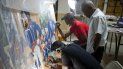 El artista haitiano Ernst Jeudy (izq.) ayuda a restaurar una pintura de Edouard Duval Carrie, junto con Franck Louissaint (centro) y Marc Gerard Estime, en el Museo de Arte de la Universidad Saint Pierre en Puerto Príncipe, Haití. El artista haitiano Ernst Jeudy (izq.) ayuda a restaurar una pintura de Edouard Duval Carrie, junto con Franck Louissaint (centro) y Marc Gerard Estime, en el Museo de Arte de la Universidad Saint Pierre en Puerto Príncipe, Haití.