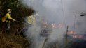Bomberos combaten un incendio en el Bosque Nacional Jacundá en la región de la Amazonía, Brasil. Bomberos combaten un incendio en el Bosque Nacional Jacundá en la región de la Amazonía, Brasil.