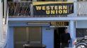 Un hombre sale de una oficina de la Western Union en La Habana, Cuba. Un hombre sale de una oficina de la Western Union en La Habana, Cuba.