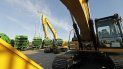 Equipos de maquinaria pesada fabricados por Deere & Company y por Caterpillar mientras están listos para su exportación a Asia en el puerto de Tacoma en Tacoma, en el estado de Washington. Equipos de maquinaria pesada fabricados por Deere & Company y por Caterpillar mientras están listos para su exportación a Asia en el puerto de Tacoma en Tacoma, en el estado de Washington.