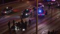 Rescatistas atienden a una mujer herida en el suelo después de que un conductor arremetió con su auto contra las personas que bloqueaban una autopista durante una protesta en Seattle, la madrugada del sábado 4 de julio de 2020. Rescatistas atienden a una mujer herida en el suelo después de que un conductor arremetió con su auto contra las personas que bloqueaban una autopista durante una protesta en Seattle, la madrugada del sábado 4 de julio de 2020.