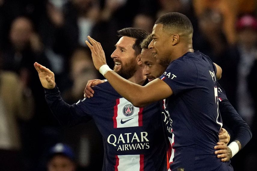 Neymar celebrates with Lionel Messi and Kylian Mbappe of Paris Saint-Germain after scoring his team's third goal in their Champions League match against Maccabi Haifa on Tuesday, October 25, 2022.