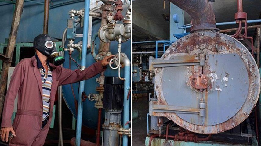 Un operario usa una cámara antigás en la fábrica de helados Coppelia, de Camagüey, Cuba, donde se produjo este miércoles 29 de noviembre un escape de amoniaco por incorrecta manipulación.