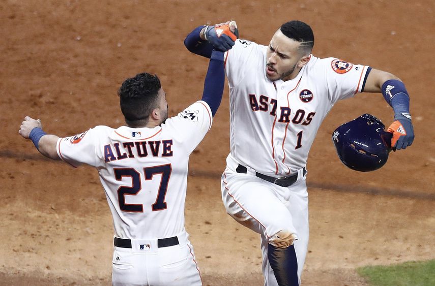 José Altuve y Carlos Correa han sido oportunos con el madero para la causa de los Astros.