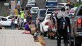 Migrantes venezolanos que intentan llegar a Estados Unidos piden dinero en una calle de Tegucigalpa el 19 de septiembre de 2023.