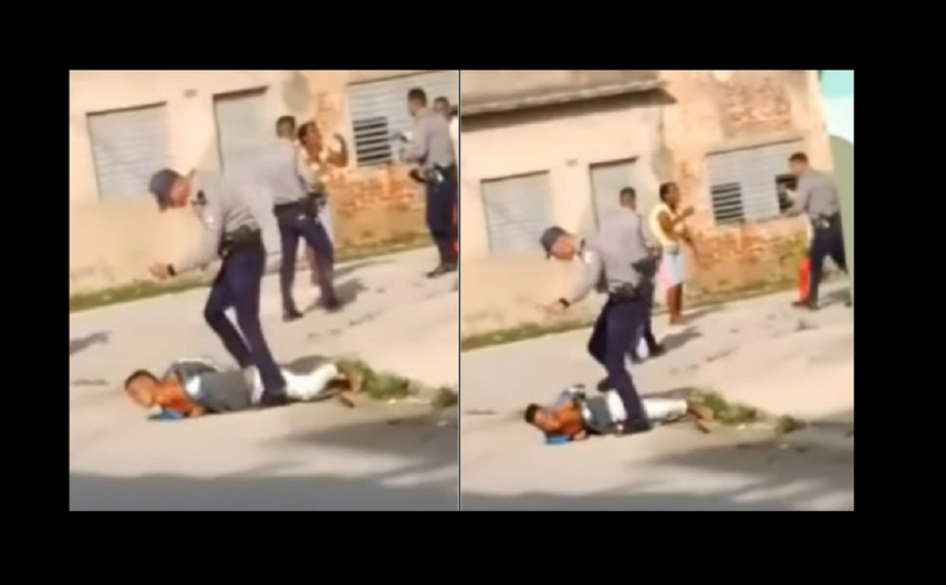 Un policía golpea a Zinadine Zidan Batista Álvarez, de 17 años, herido y esposado.&nbsp;&nbsp;