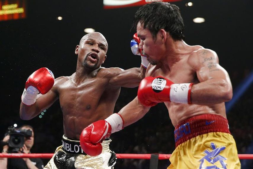 En la noche en la que Mayweather Jr defendió su invicto y derrotó Manny Pacquiao (EFE)