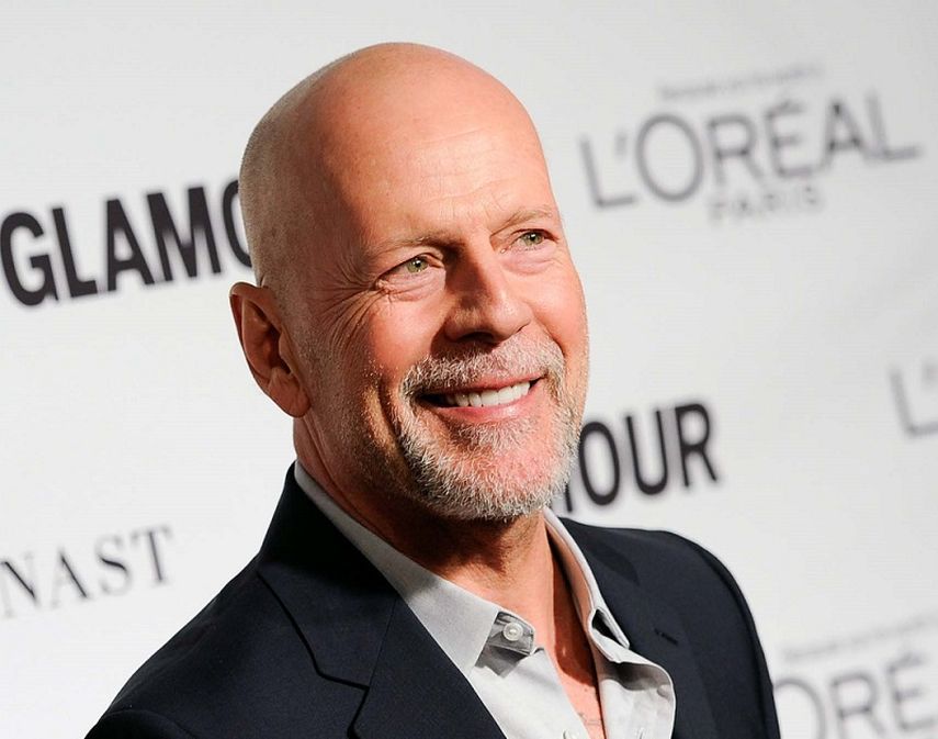 El actor estadounidense Bruce Willis posa para las cámaras durante un evento de la revista Glamour, 2014. (AP). 