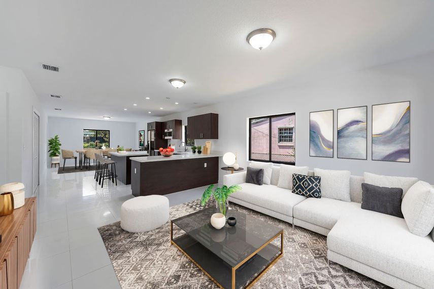 Vista de la cocina-comedor y family de una propiedad de Bluenest.