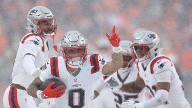 Christian Gonzalez #0 of the New England Patriots celebrates with teammates after intercepting a pass from Jarrett Stidham #8 of the Denver Broncos (not pictured) intended for Marvin Mims Jr. #19 (not pictured) during the fourth quarter in the AFC Championship Playoff game at Empower Field At Mile High on January 25, 2026 in Denver, Colorado. The New England Patriots defeat the Denver Broncos 10-7.&nbsp;