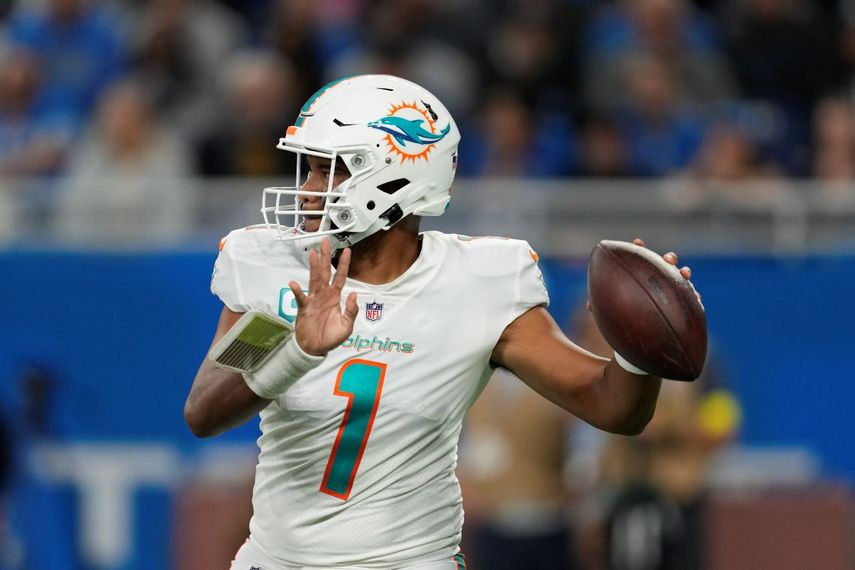 Tua Tagovailoa throws for the Miami Dolphins against the Lions in Detroit, Sunday, Oct. 30, 2022. (AP Photo/Paul Sancya)
