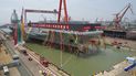 Botadura en Shanghái del primer portaaviones de China de última generación, bautizado como Fujian