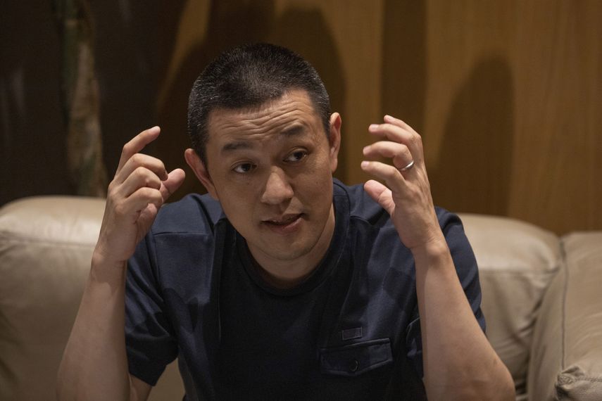 El director general de NIO, William Li, habla en un evento en la tienda principal de la compañía en Pekín.