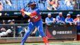 El pelotero cubano Yoenis Céspedes consigue un hit en un juego del grupo A contra Holanda en el Clásico Mundial de Béisbol en el estadio intercontinental Taichung en Taichung, Taiwán, el miércoles 8 de marzo de 2023.