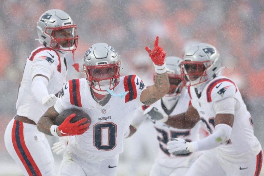 Christian Gonzalez #0 of the New England Patriots celebrates with teammates after intercepting a pass from Jarrett Stidham #8 of the Denver Broncos (not pictured) intended for Marvin Mims Jr. #19 (not pictured) during the fourth quarter in the AFC Championship Playoff game at Empower Field At Mile High on January 25, 2026 in Denver, Colorado. The New England Patriots defeat the Denver Broncos 10-7.&nbsp;