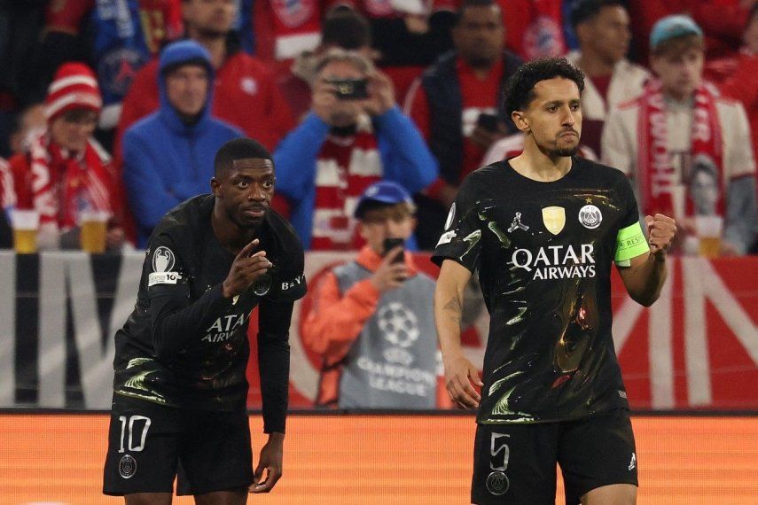 El delantero francés del Paris Saint-Germain, Ousmane Dembélé (izq.), número 10, celebra el primer gol de su equipo con el defensa brasileño del Paris Saint-Germain, Marquinhos (número 5), durante el partido de vuelta de las semifinales de la Liga de Campeones de la UEFA entre el FC Bayern de Múnich y el Paris Saint-Germain (PSG) en Múnich, al sur de Alemania, el 6 de mayo de 2026.&nbsp;