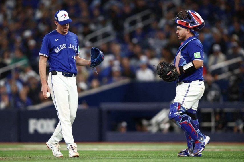 Chris Bassitt #40 and Alejandro Kirk #30 of the Toronto Blue Jays speak on the field during the eighth inning against the Seattle Mariners in game two of the American League Championship Series at Rogers Centre on October 13, 2025 in Toronto, Ontario.&nbsp;