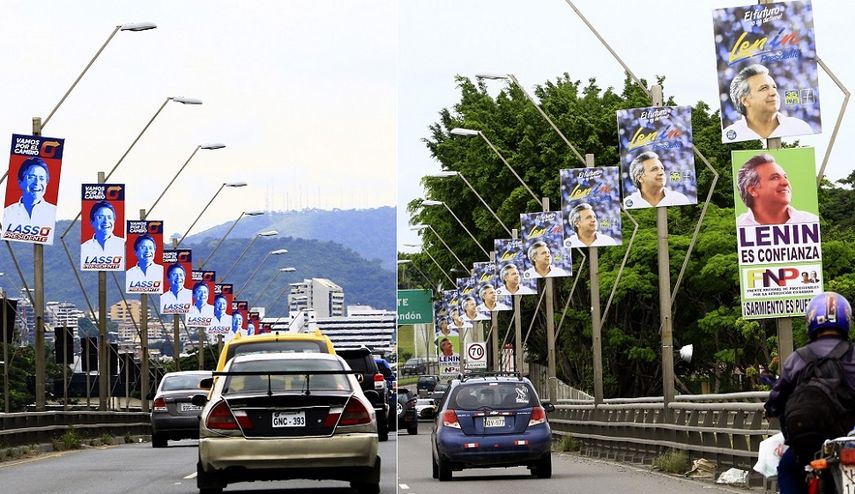 Vista de los afiches de campaña que sobreviven al silencio electoral que precede la realización de los comicios presidenciales este domingo 2 de abril en Ecuador.
