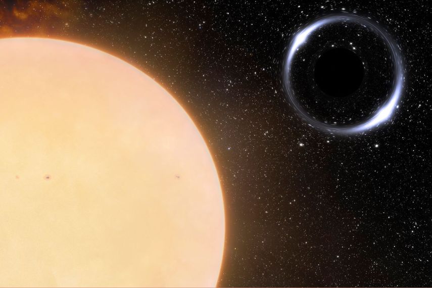 Esta ilustración proporcionada por el centro astronómico NOIRLab en noviembre de 2022 muestra el hoyo negro más cercano a la Tierra y la estrella que lo acompaña, la cual es similar al Sol.&nbsp;