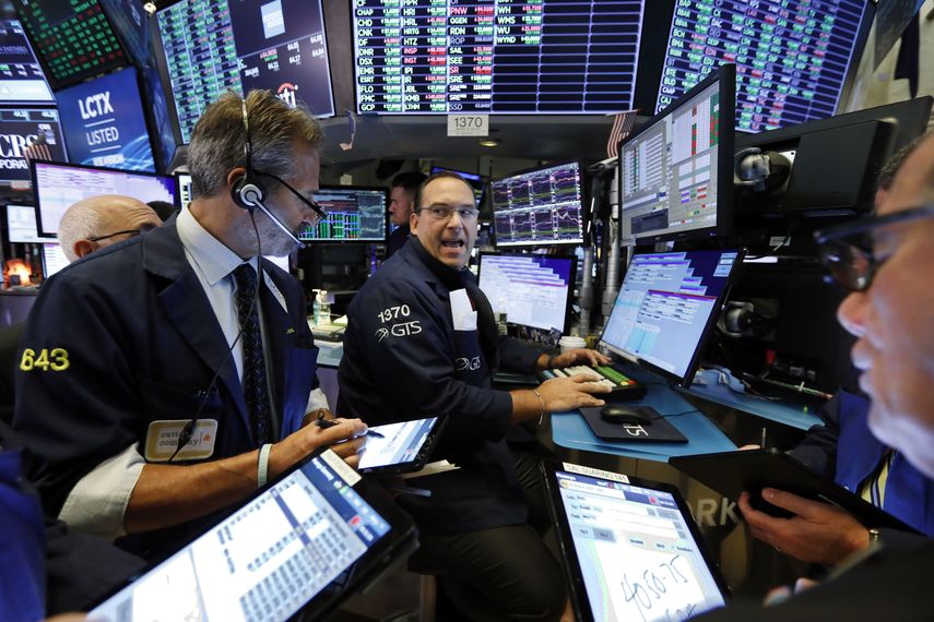 Especialistas&nbsp;y corredores en la Bolsa de Valores de Nueva York.