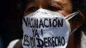 Una enfermera usa una mascarilla que dice “¡Vacunación ahora! Es mi derecho ”durante una protesta para exigir que todos los trabajadores de la salud sean vacunados contra el COVID-19, en la plaza Los Palos Grandes, en Caracas el 17 de abril de 2021. Una enfermera usa una mascarilla que dice “¡Vacunación ahora! Es mi derecho ”durante una protesta para exigir que todos los trabajadores de la salud sean vacunados contra el COVID-19, en la plaza Los Palos Grandes, en Caracas el 17 de abril de 2021.