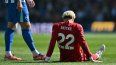 El delantero francés del Liverpool, Hugo Ekitike, número 22, reacciona tras sufrir una lesión durante el partido de la Premier League inglesa entre el Brighton and Hove Albion y el Liverpool en el American Express Community Stadium en Brighton, al sur de Inglaterra, el 21 de marzo de 2026. El delantero francés del Liverpool, Hugo Ekitike, número 22, reacciona tras sufrir una lesión durante el partido de la Premier League inglesa entre el Brighton and Hove Albion y el Liverpool en el American Express Community Stadium en Brighton, al sur de Inglaterra, el 21 de marzo de 2026.