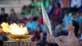 La actriz Mary Mina, como una sacerdotisa griega, sostiene una antorcha con la llama de los Juegos Olímpicos, el viernes 26 de abril de 2024, en el Estadio Panatenaico de Atenas, donde se celebraron los primeros Juegos Olímpicos de la actual era, en 1896.&nbsp;