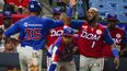 Henry Urrutia (izquierda), de República Dominicana, es felicitado por su compañero Emilio Bonifacio tras anotar ante Venezuela en la final de la Serie del Caribe, el viernes 10 de febrero de 2023&nbsp;