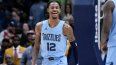 Ja Morant (12), escolta de los Grizzlies de Memphis, reacciona después de una clavada en los últimos segundos del tiempo extra durante el partido de baloncesto de la NBA en contra de los Pelicans en Nueva Orleans, el martes 26 de diciembre de 2023. Ja Morant (12), escolta de los Grizzlies de Memphis, reacciona después de una clavada en los últimos segundos del tiempo extra durante el partido de baloncesto de la NBA en contra de los Pelicans en Nueva Orleans, el martes 26 de diciembre de 2023.
