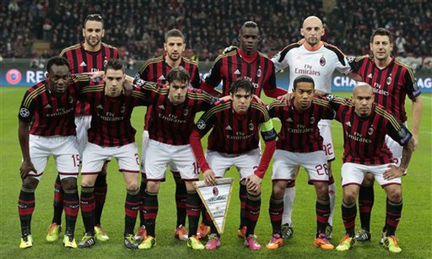 AC Milans players, background from left, Adil Rami, Adel Taarabt, Mario Balotelli, goalie Christian Abbiati, Daniele Bonera, front row from left, Michael Essien, Mattia De Sciglio, Andrea Poli, Ricardo Kaka, Urby Emanuelson, and Nigel De Jong, pose fo