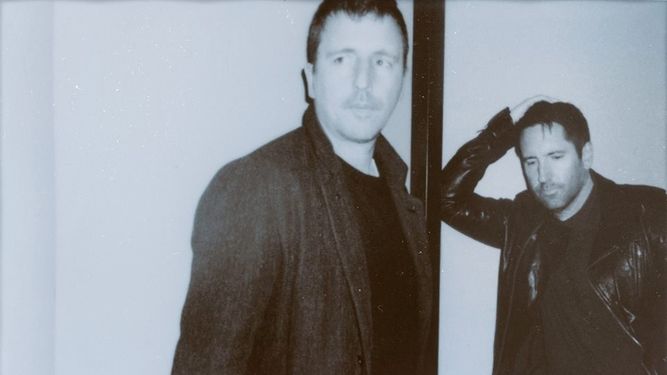 Los músicos Atticus Ross y Trent Reznor.