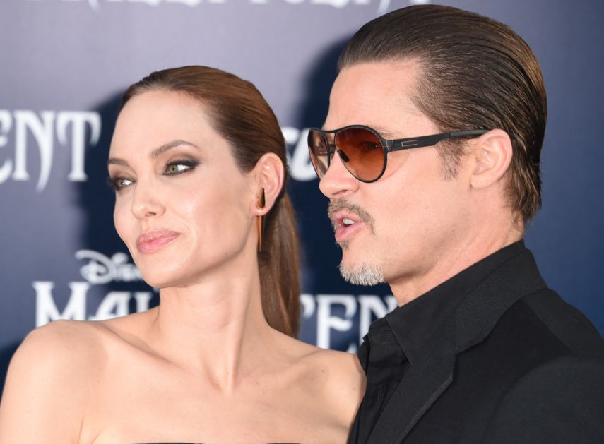 En esta foto de archivo tomada el 28 de mayo de 2014, los actores Angelina Jolie y Brad Pitt llegan para el estreno mundial de Maléfica&nbsp;de Disney, en El Capitan Theatre de Hollywood.&nbsp;