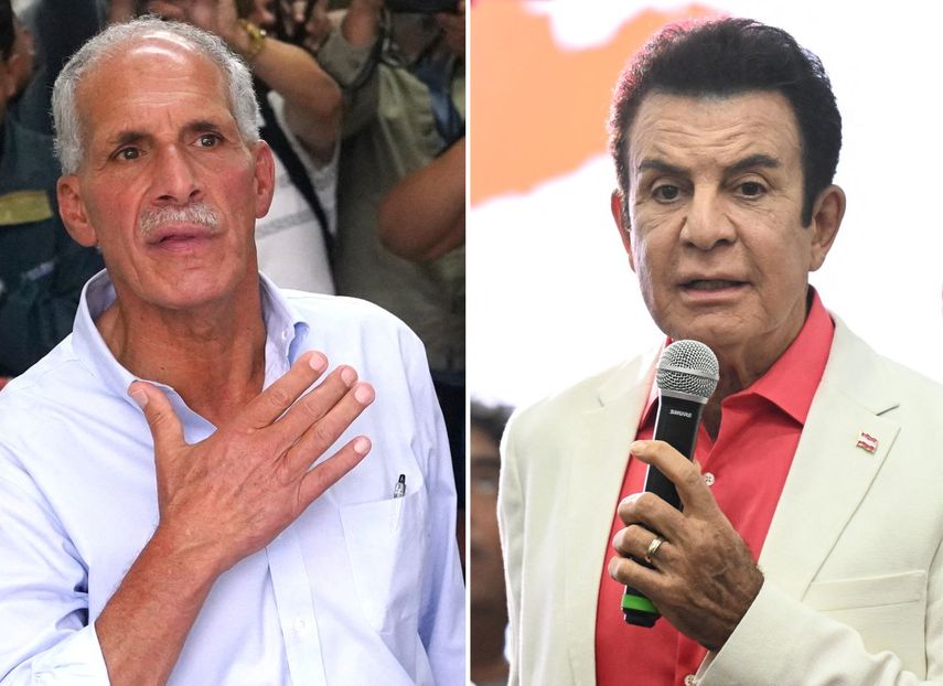 El candidato presidencial de Honduras del Partido Nacional, Nasry Asfura (izq.), muestra su dedo entintado después de emitir su voto en Tegucigalpa el 30 de noviembre de 2025, y el candidato por el partido opositor Liberal, Salvador Nasralla, un exaliado de la izquierdista y prochavista presidenta de Honduras, Xiomara Castro.