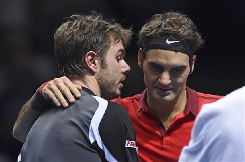 John McEnroe, que estuvo en Londres como comentarista para ESPN, reveló que algo pasó en el vestuario entre Fed y Wawrinka. (AP)