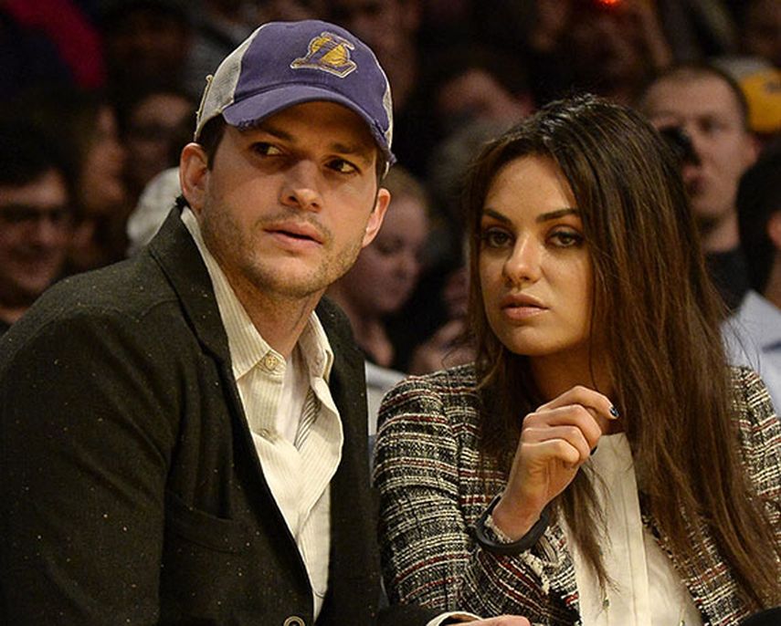 El actor estadounidense Ashton Kutcher (izda) y su prometida, la actriz Mila Kunis (dcha). EFE/Michael Nelson PROHIBIDO SU USO EN CORBIS