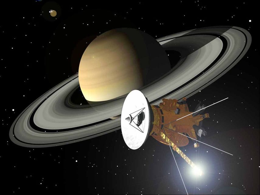 Ilustración que muestra a la sonda espacial Casinni y al planeta Saturno (CORTESÍA)