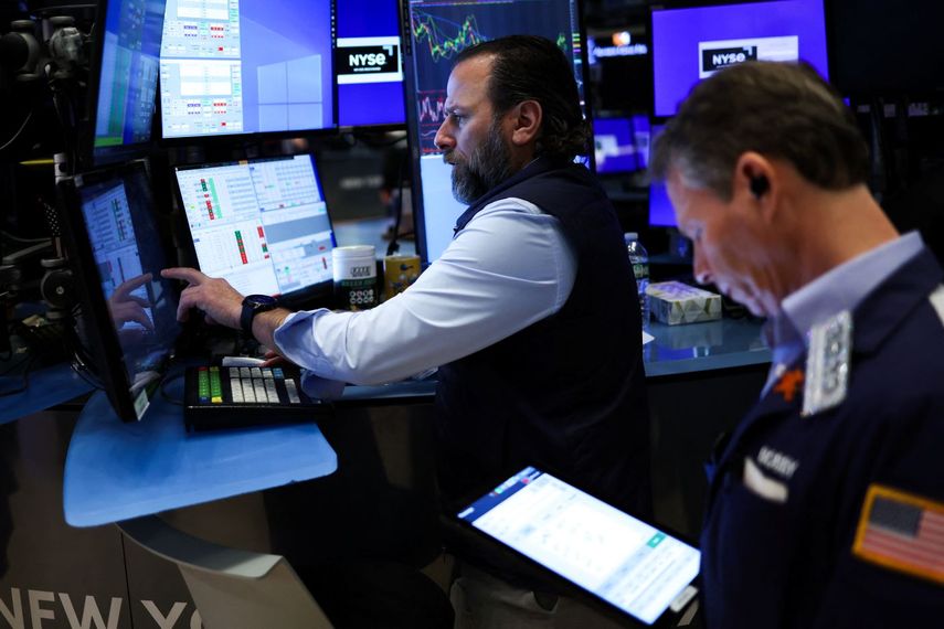 Agentes de la Wall Street durante una sesión de la Bolsa.