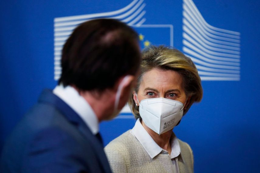 European Commission President Ursula von Der Leyen (R) welcomes Romania’s Prime Minister Florin Citu before their meeting at the European Commission headquarters in Brussels on February 12, 2021.