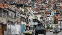 Un vehículo blindado VN-4 de una unidad especial de la Policía Nacional recorre una de las calles principales del barrio Cota 905 luego de tres días de enfrentamientos con presuntos integrantes de una banda criminal, en Caracas el 9 de julio de 2021. Un vehículo blindado VN-4 de una unidad especial de la Policía Nacional recorre una de las calles principales del barrio Cota 905 luego de tres días de enfrentamientos con presuntos integrantes de una banda criminal, en Caracas el 9 de julio de 2021.