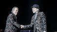 Los cantantes Joan Manuel Serrat y Joaqu&iacute;n Sabina se dan la mano durante su actuaci&oacute;n en el WiZink Center de Madrid el pasado 20 de enero de 2020.&nbsp; &nbsp; &nbsp;