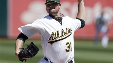 Lester, antiguo miembro de los Medias Rojas y Atléticos, será el nuevo as en la rotación de los Cachorros. (AP)