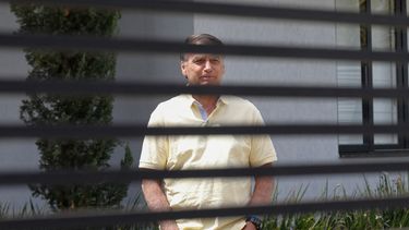 Former Brazilian President Jair Bolsonaro gestures from his residence in Brasilia on September 3, 2025.