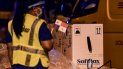Workers unload containers carrying the first shipment of the Pfizer/BioNTech COVID-19 vaccine for Panama, from a courier aircraft transporting some 12,840 doses of the vaccine into the country, at Tocumen International Airport in Panama City on January 20, 2021. Workers unload containers carrying the first shipment of the Pfizer/BioNTech COVID-19 vaccine for Panama, from a courier aircraft transporting some 12,840 doses of the vaccine into the country, at Tocumen International Airport in Panama City on January 20, 2021.