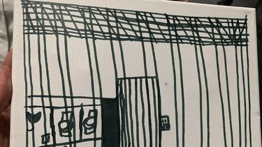 Foto presentada por la Academia Estadounidense de Pediatría de un dibujo realizado por un niño migrante en un centro de detención en McAllen, Texas.