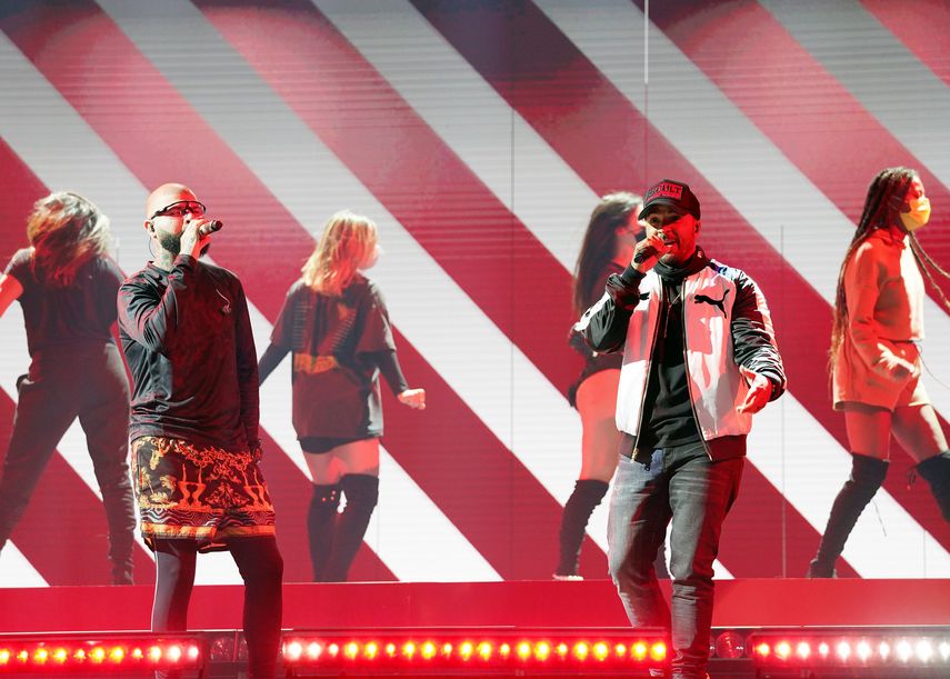Los puertorriqueños Farruko y Luis Fonsi.