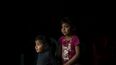 Los niños pequeños son fotografiados en su casa en la aldea Juvinani, municipio de Metlatonoc, estado de Guerrero, México, el 16 de mayo de 2021.&nbsp;