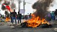 Manifestantes toman la carretera Panamericana en el Cono Norte de Arequipa tras el anuncio de la nueva presidenta peruana Dina Boluarte de su intención de presentar un proyecto de ley al parlamento para adelantar las elecciones generales previstas de abril de 2026 a abril de 2024 en Arequipa, Perú, el 12 de diciembre de 2022