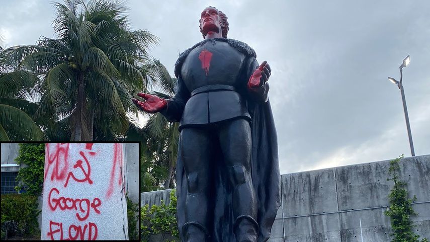 La estatua de Crist&oacute;bal Col&oacute;n fue vandalizada con s&iacute;mbolos comunistas en Miami.